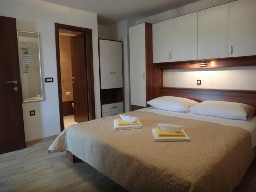Cama o camas de una habitación en Apartments Selina