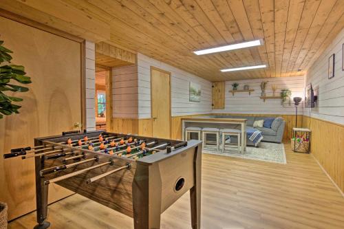 a living room with a large foosball table at Secluded Cabin with Spacious Kitchen and Dining Area! in Sunset