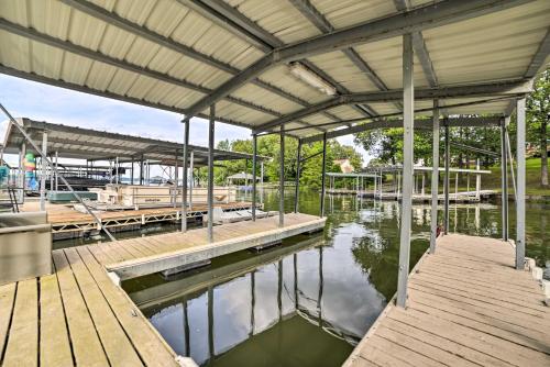 a marina with a wooden dock and water at Kentucky Lake House with a Great Outdoor Space! in Gilbertsville