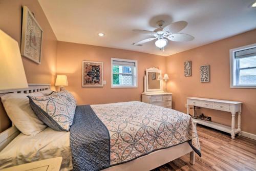 a bedroom with a bed and a ceiling fan at Kentucky Lake House with a Great Outdoor Space! in Gilbertsville