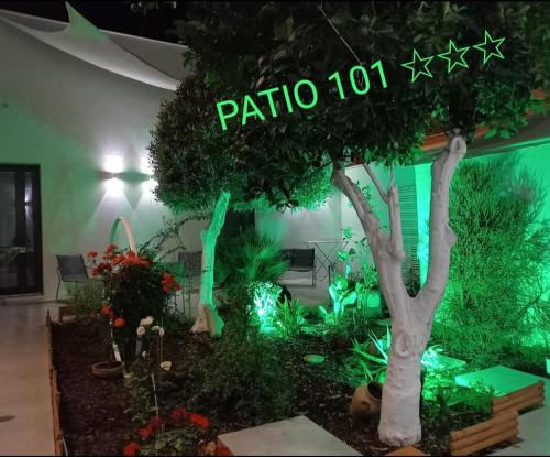 a garden in a room with a sign that reads patio at Patio 101 "Exclusive" in San Vito lo Capo