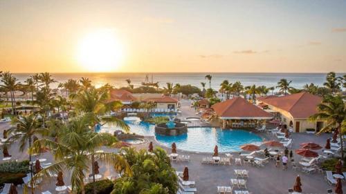 an aerial view of a resort with a pool at La Cabana BRC Studio & Apartment in Palm-Eagle Beach