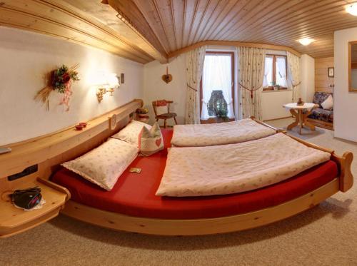a large bedroom with two beds in a room at Gästehaus Restner - Chiemgau Karte in Inzell