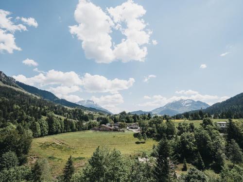 a view of a valley with mountains in the background at VAYA Fieberbrunn inklusive Gästekarte in Fieberbrunn