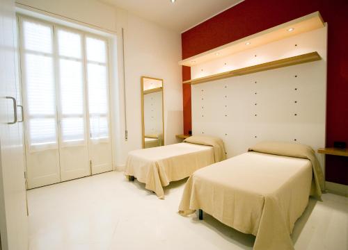 Ένα ή περισσότερα κρεβάτια σε δωμάτιο στο Residence Arco Antico