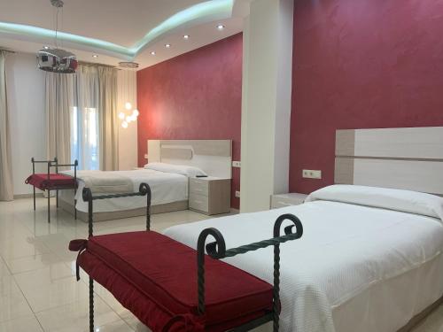 Postel nebo postele na pokoji v ubytování Hostal Poeta Machado
