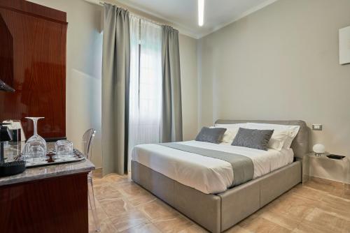 a bedroom with a bed and a window at The Rif - Boutique Hotel in Pisa
