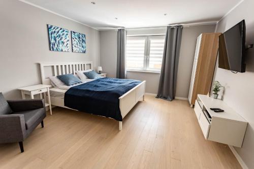 Postel nebo postele na pokoji v ubytování Apartamenty Trzy Rybki