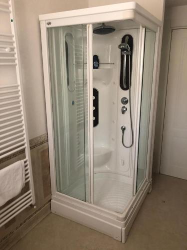 a shower with a glass door in a bathroom at Villa Carmen Resort in Campobasso