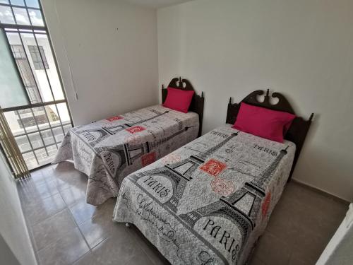 Postel nebo postele na pokoji v ubytování Casa Magnolia Queretaro TODO INCLUIDO