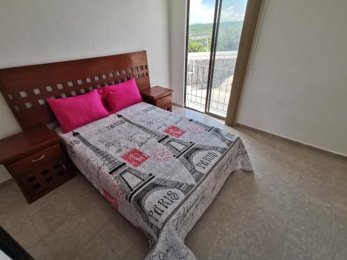Postel nebo postele na pokoji v ubytování Casa Magnolia Queretaro TODO INCLUIDO