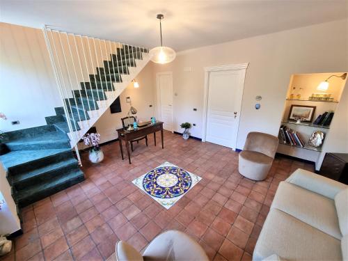 an aerial view of a living room with a staircase at Casa Fifina Rooms in Sant'Egidio del Monte Albino