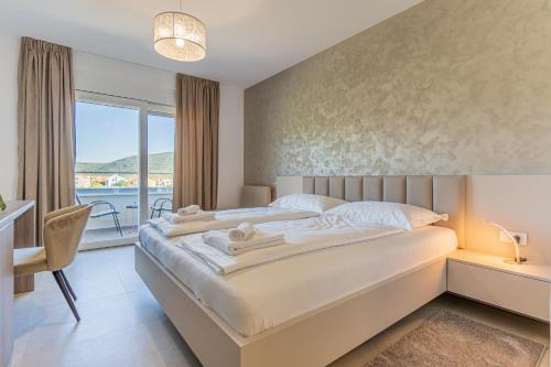 Ένα ή περισσότερα κρεβάτια σε δωμάτιο στο Villa Orhideja