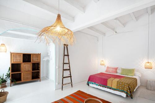 Cama o camas de una habitación en La Cayena Rooms & Apartments