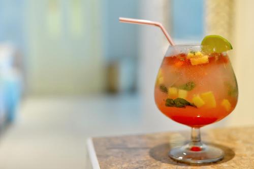 a drink with a lime in a glass on a counter at Radisson Cartagena Ocean Pavillion Hotel in Cartagena de Indias