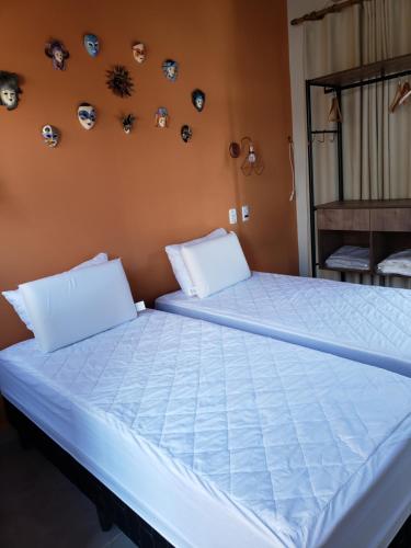 Posteľ alebo postele v izbe v ubytovaní Suítes Verano Ubatuba - NOVAS - Bairro de Itaguá com piscina