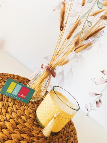 a basket with wheat grains and a glass at Miło Cię widzieć in Łeba