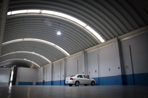 a white car parked in a parking garage at Hotel El Senador in Mexico City