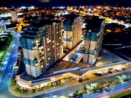 a view of a city at night with buildings at ENJOY OLIMPIA PARK RESORT - Thermas dos Laranjais in Olímpia