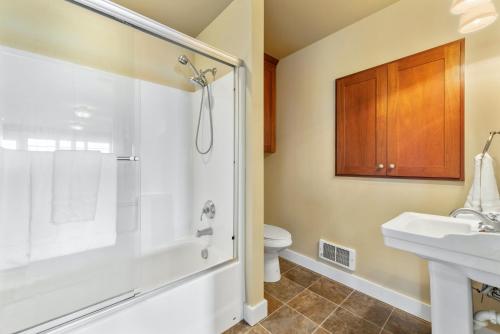 a bathroom with a shower and a sink and a toilet at @ Marbella Lane - Waterfront Studio Whidbey Island in Coupeville