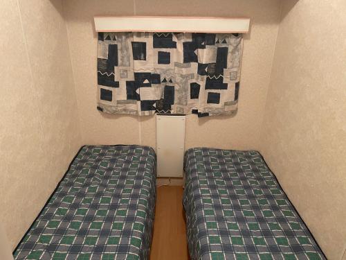 
Säng eller sängar i ett rum på Paradiset Östra Öland
