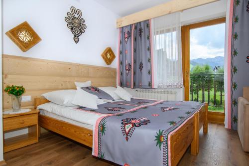 Llit o llits en una habitació de Willa Halinka