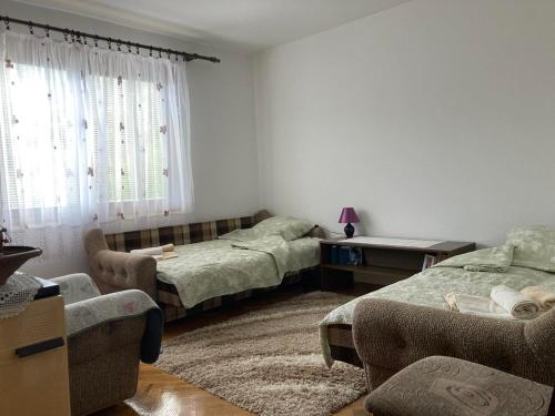 A bed or beds in a room at apartman Mara