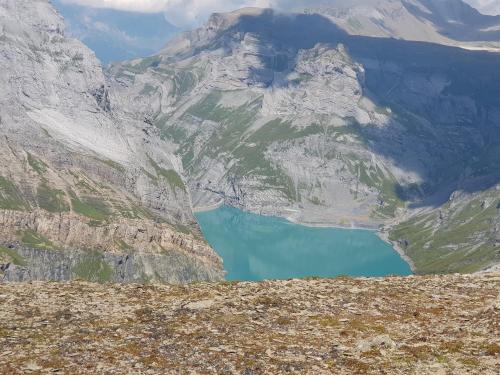 a view of a mountain with a blue lake at Boutique-Hotel Vincenz in Brigels