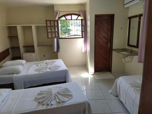 Un pat sau paturi într-o cameră la Hotel Sol Bahia