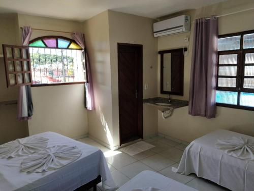 Cama ou camas em um quarto em Hotel Sol Bahia