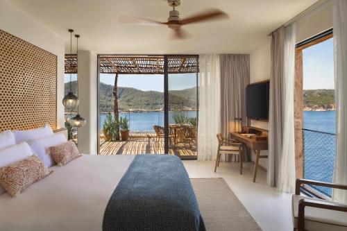 
a hotel room with a view of the ocean at Six Senses Ibiza in Portinatx
