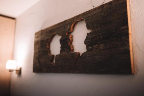 a painting of two people on a wall at SennHOF Lechtal in Bach