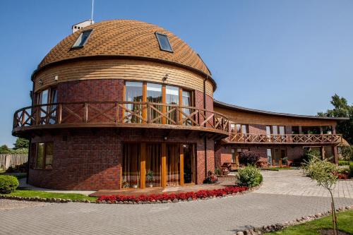 a round house with a dome on top of it at Vila Sraige in Palanga