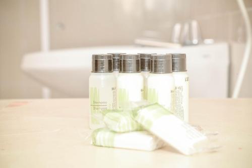 a group of three bottles sitting on top of a counter at Terrazza Hotel in Campos do Jordão