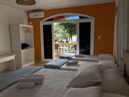 
Cama ou camas em um quarto em Pousada Marinamarela
