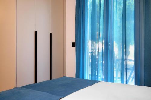 Ένα ή περισσότερα κρεβάτια σε δωμάτιο στο AMMOESSA APARTMENTS