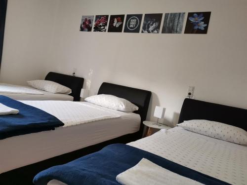 two beds in a room with two beds sidx sidx sidx at DreamHouse in Jajce