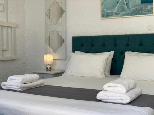 Postelja oz. postelje v sobi nastanitve Vougli View Mykonos