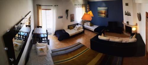 an aerial view of a living room with blue walls at Peniche Surf Lodge 2 in Peniche