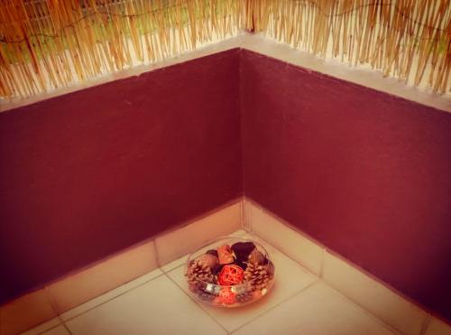 a small bowl of food in a corner of a room at Studio apartment Meli in Ogulin