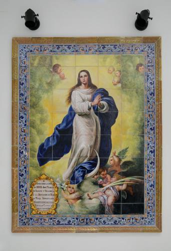 a painting of theoration of the virginunciation on a wall at Planeta Cadiz Hostel in Cádiz