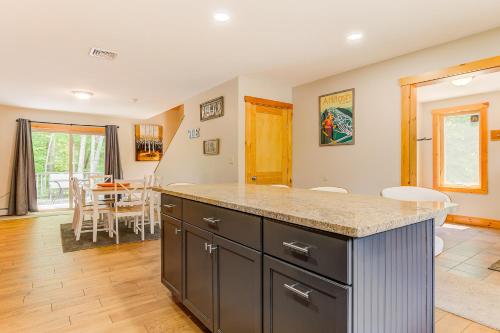 a kitchen with a counter and a dining room at Bear Village 14 in Bartlett