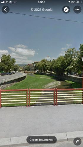 a screenshot of a photo of a fence with a park at Anton Apartment in Kochani