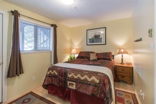 a bedroom with a bed and a window at Edelweiss #202 in Brian Head