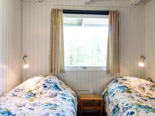 Postel nebo postele na pokoji v ubytování Holiday home Fanø LXXXIV