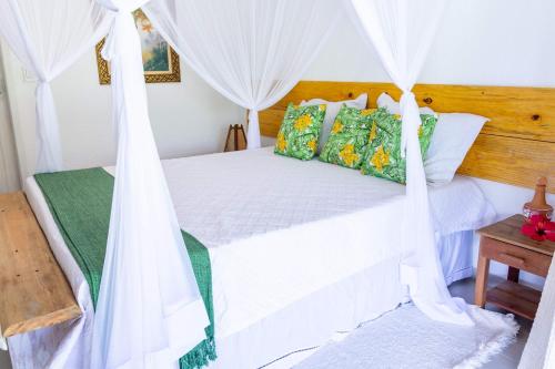 A bed or beds in a room at Pousada Rio da Vila