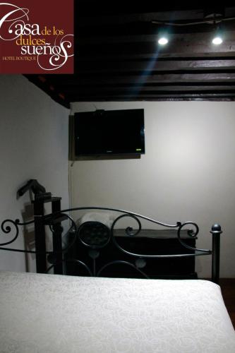 Una cama o camas en una habitación de Casa de los Dulces Sueños
