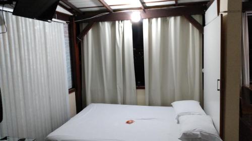 Кровать или кровати в номере Loft Santos Dumont