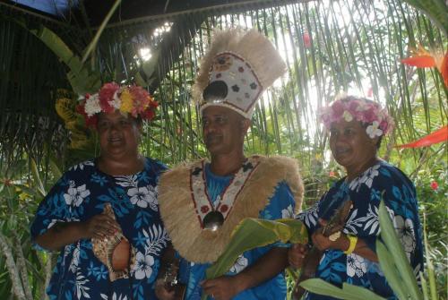 a group of three people wearing flowers on their hats at La Perle Tahaa in Tapu' amu