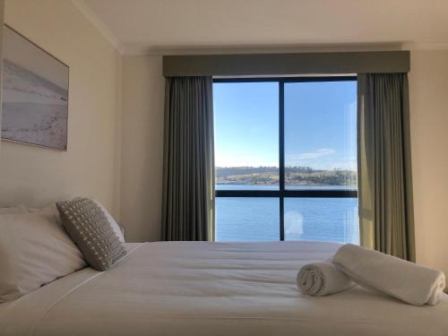 Un pat sau paturi într-o cameră la Eastcoaster Tasmania